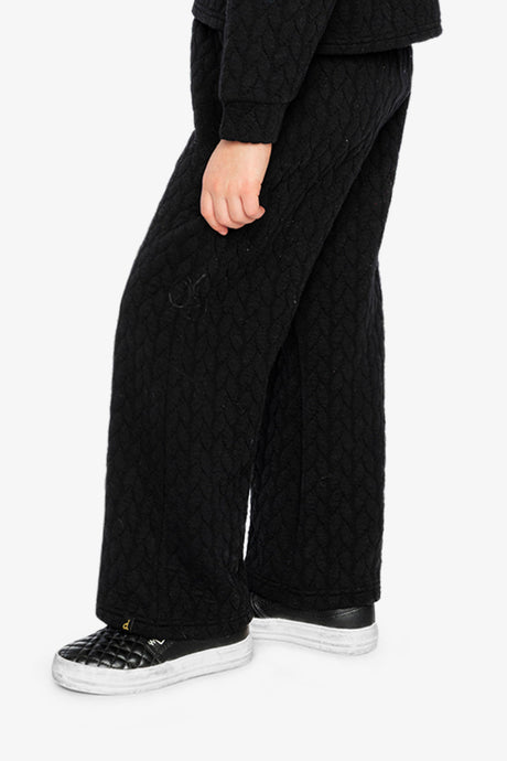 Child wearing the Wide Leg Jacquard Pants Black, side view