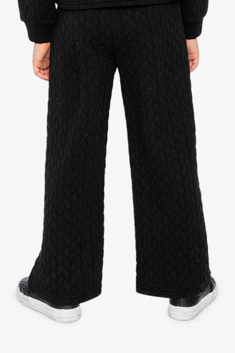 Child wearing the Wide Leg Jacquard Pants Black, back view