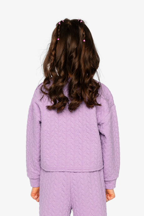Child wearing the purple cropped jacquard pullover, back view