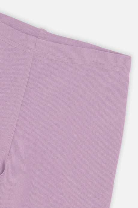 Close-up of the rib texture and waistband on violet leggings