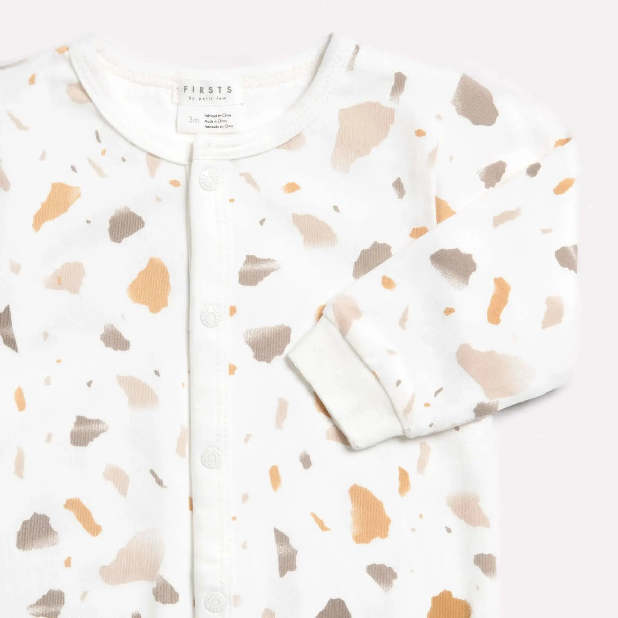 "golden pebble terrazzo" print on off-white sleeper | petit lem