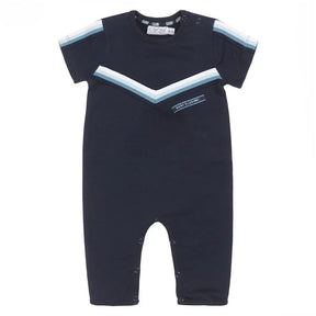 Front view of navy Dirkje baby boys romper with blue and white chevron stripes