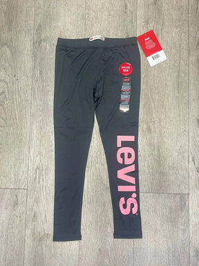 Girls' dark charcoal Levi's jeggings front view with large vertical pink logo on left leg
