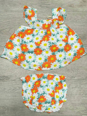Angel Dear Happy Daisy orange and white cotton muslin pinafore top and bloomer set on wood background