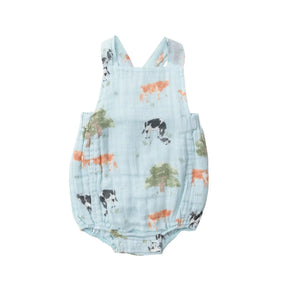 Front of the Angel Dear Cows retro sunsuit in pale blue muslin with cows and trees