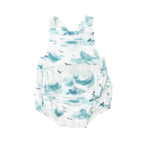 Front of the Angel Dear Ocean Waves retro sunsuit in white with teal wave print