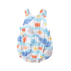 Front of the Angel Dear Wavey Sea Creatures retro sunsuit with whales and crabs on blue waves