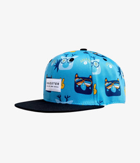 Sky blue Teddy's Cool kids snapback with sunglass-wearing animal faces, black brim and Headster patch