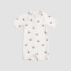 Miles The Label baby boys Creme king crab swim romper with UPF 50+, short sleeves, and front zipper.