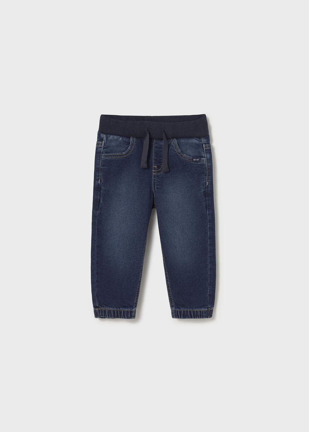 Front flat lay of dark denim jogger baby jeans showing tapered ankle.