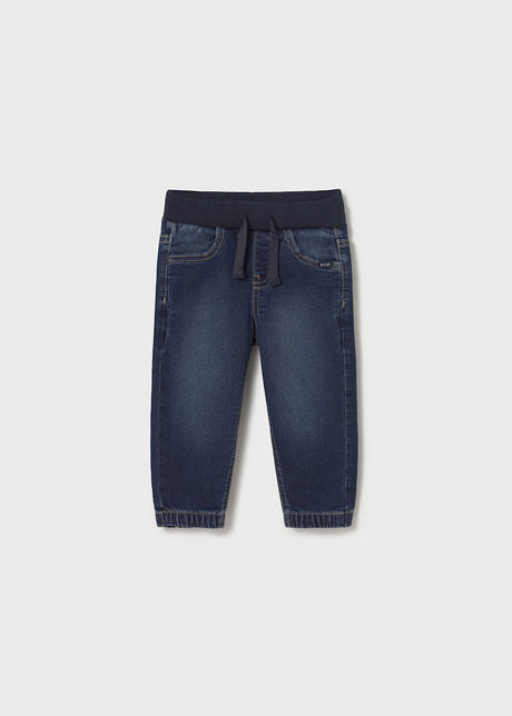Front flat lay of Mayoral baby denim jogger pants in Dark Denim/Navy with cuffed hems.