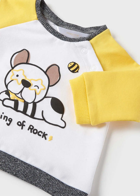 Closeup of shoulder snap buttons and soft knit neckline.