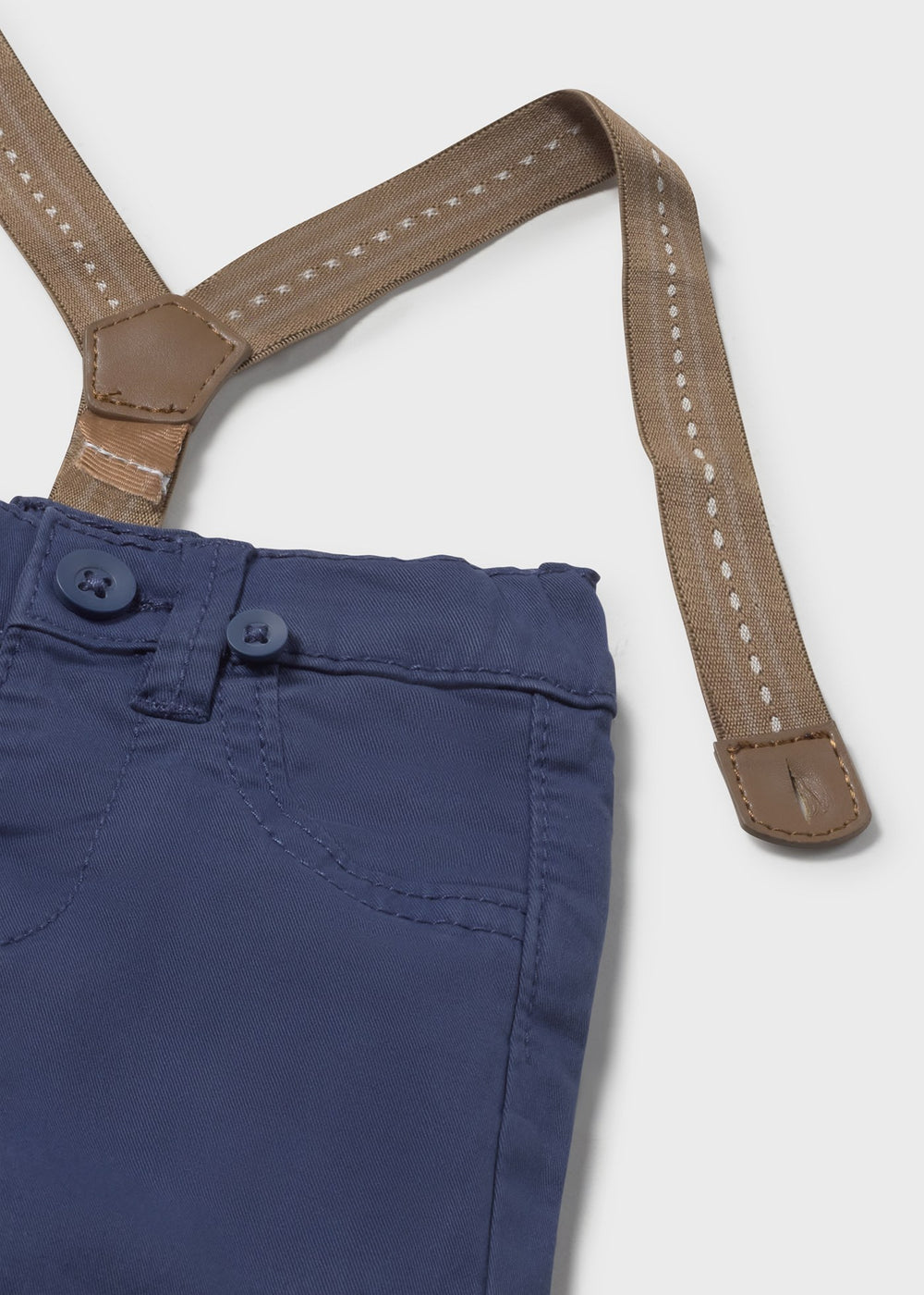 Closeup of button waist and inner-button adjusters on newborn pants.