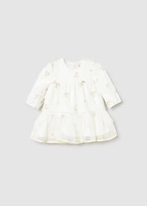 Front view of ivory Mayoral newborn girl tulle dress with gold motifs and tiered skirt