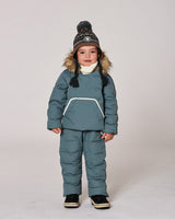 Model in one-piece pram suit gray/blue with sherpa-lined hood — almost gone