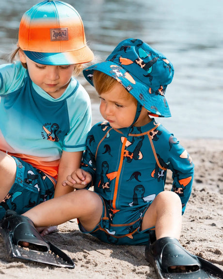 Printed Long Sleeve One-Piece Rashguard Orange Sloths On Navy Blue | Deux par Deux | Jenni Kidz