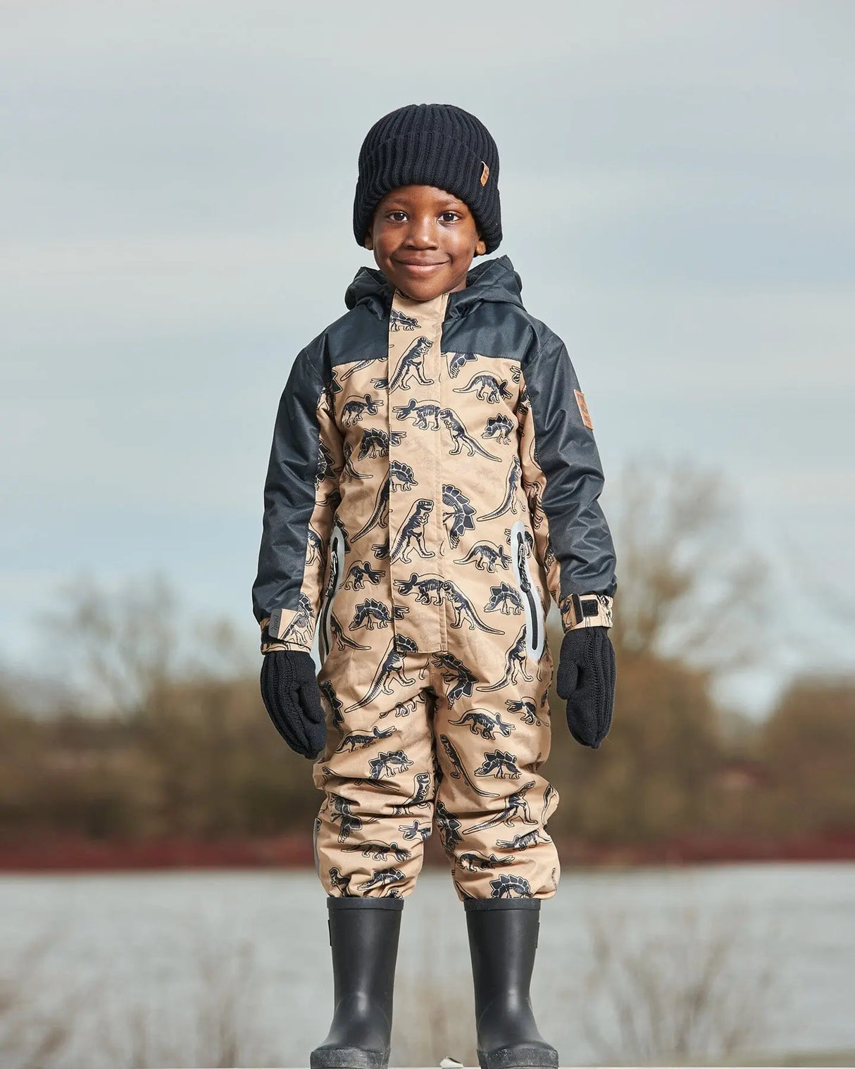 Printed Mid-Season One-Piece Outerwear Black Dinosaur On Beige Background | Deux par Deux | Jenni Kidz