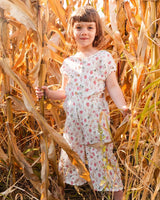 Printed Seersucker Jumpsuit With Cut Outs Pink Flowers On Cream Background | Deux par Deux | Jenni Kidz