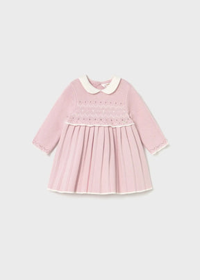 Front view of soft pink Mayoral baby girl knit dress with white collar and pleated skirt