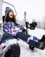 Three-quarter flat view of the pink & blue marble one-piece snowsuit highlighting the streamlined silhouette
