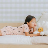 Toddler wearing toucan print summer pajama set Petit Lem