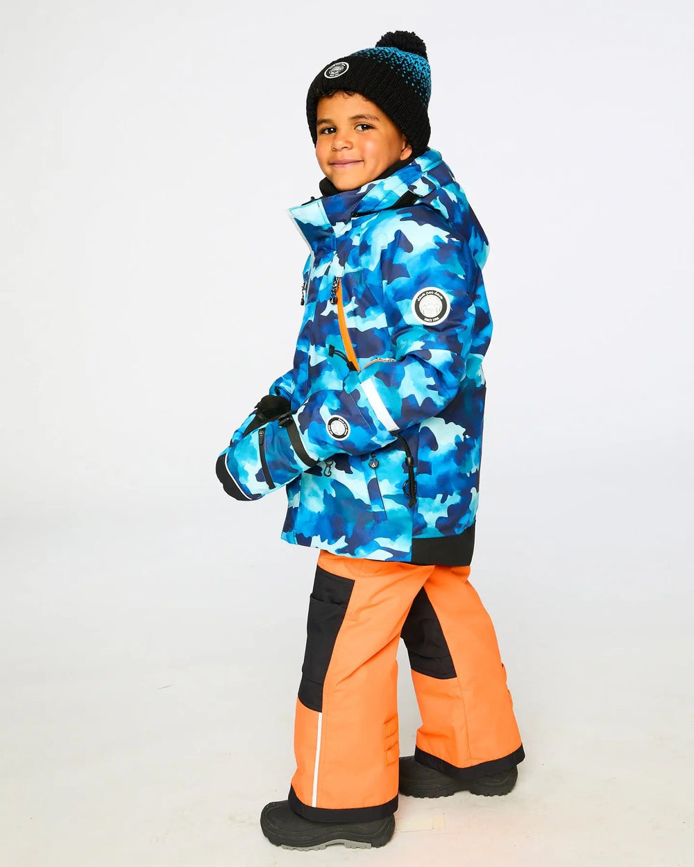 Rear view of jacket, storm flap and adjustable hood, two-piece ski suit.