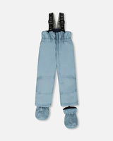 Gray high-waisted pants with suspenders, snow guards, and under-boot straps.