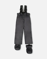 Charcoal bib pants with Cordura knees and ankle snow guards, ready to ship — buy now.