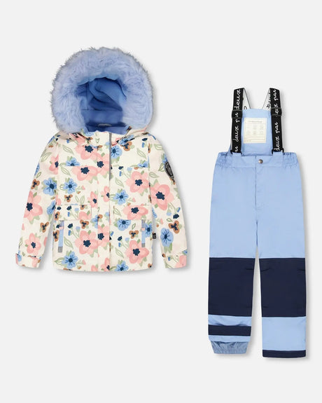Flat lay girls two-piece ski suit with light-blue printed jacket and navy pants.