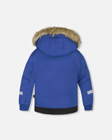 Back view two-piece kids ski suit with hood and snow skirt