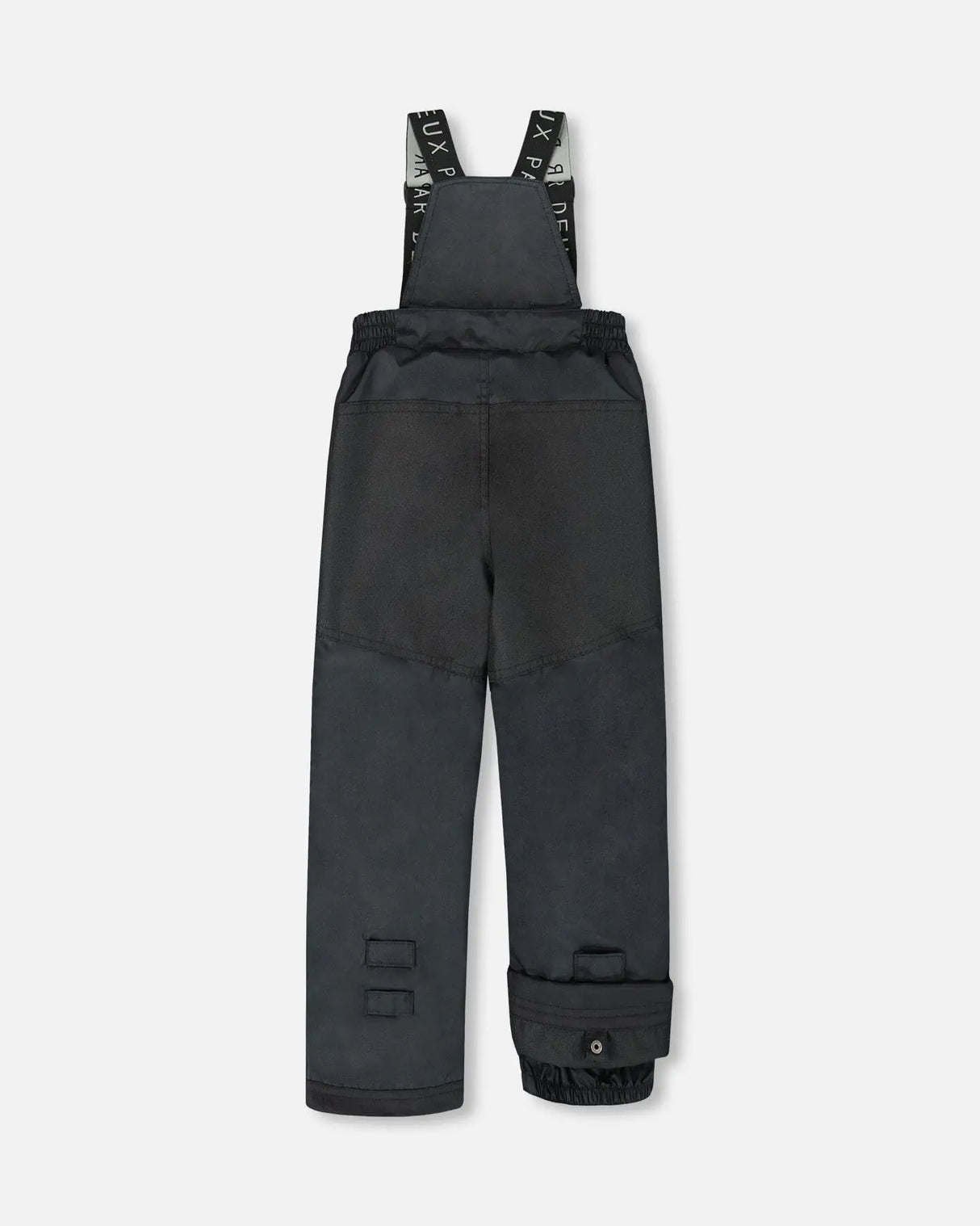 Black bib pants with Cordura knees and ankle gaiters — boys jacket and snow pants.