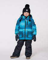 Two-piece ski suit on model, printed jacket with hood