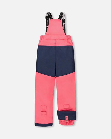 Navy bib pants with Cordura® panels, articulated knees, and removable suspenders.