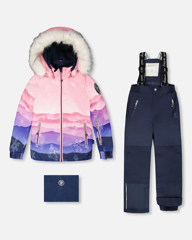 Girls two-piece ski suit — pink gradient jacket with navy pants, waterproof to -30C.