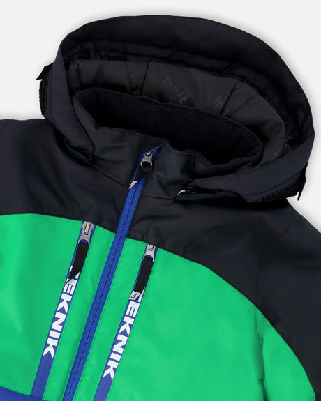 Collar detail with chin guard and wind flap, storm-ready jacket and snow pants.