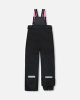 Snow pants with articulated knees and adjustable straps