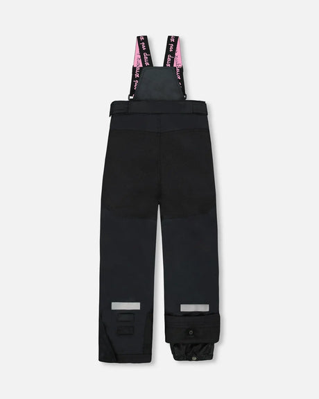 Snow pants with articulated knees and adjustable straps