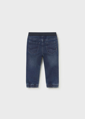 Back view of Mayoral baby boy jogger jeans showing Dark Blue denim wash and cuffed legs.