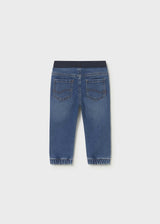 Back view of Mayoral baby boy jogger jeans showing Dark Blue denim wash and cuffed leg openings.