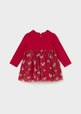 Back view of the red heart-print tulle dress showing the back zipper with pink pull