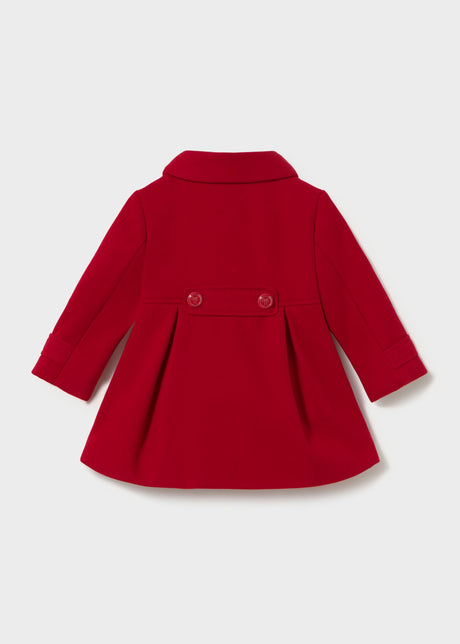 Back of the red coat with two buttons on a waist tab and a box pleat