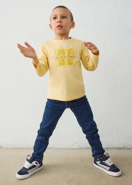 Child wearing the dark wash Mayoral jeans, front view