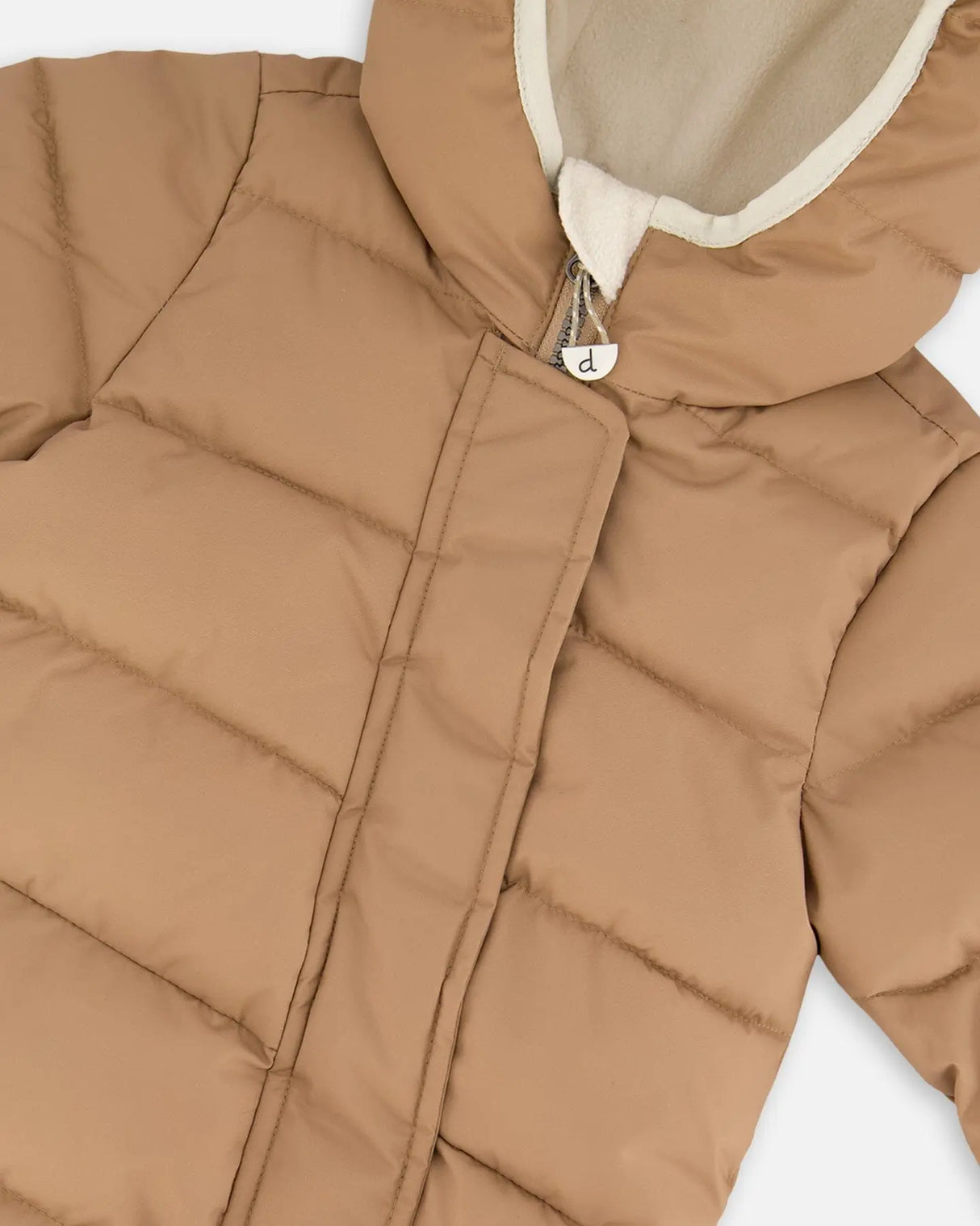 Close-up quilting and PrimaLoft insulation of Baby Cloud snowsuit