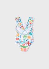 Back view of Mayoral girls ruffled one-piece swimsuit showing colorful print and swim fit.