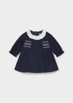 Mayoral baby girl navy polka dot dress with pleated ivory collar and white smocking, front view
