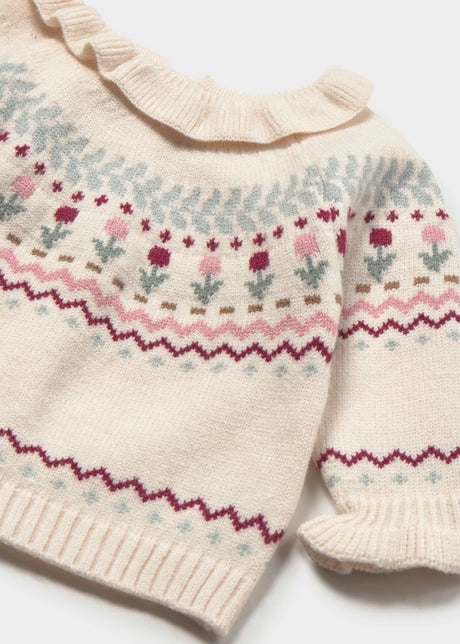 Close-up of the patterned knit, ruffled collar and cuff on the Mayoral baby sweater