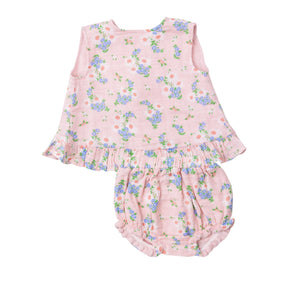 Front of the Angel Dear Gathering Daisies ruffle back top and bloomer set on pink muslin