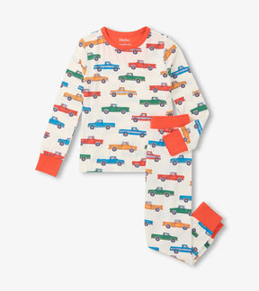 Hatley boys bamboo pajama set in Cream/Orange with colorful trucks print and matching long pants.