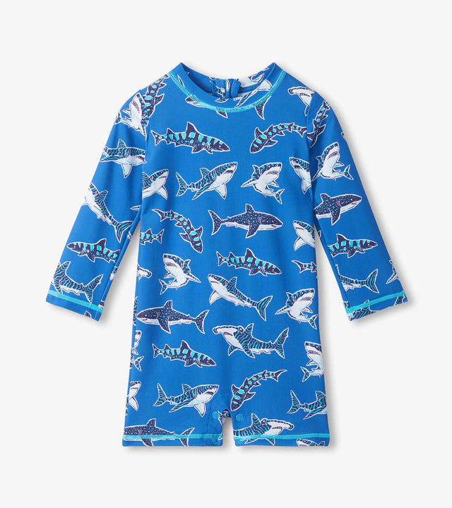 Hatley baby boy UPF50+ rashguard swimsuit in Blue with Patterned Sharks print and long sleeves.