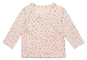 Front of Noppies Lyoni pale pink baby wrap top with dark dots, long sleeves and a curved snap opening.